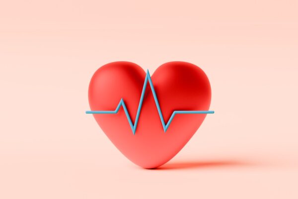 Conceptual image of a red heart with a line graph in front symbolizing Heart or ECG
