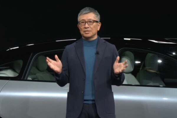 man in front of car