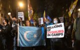 Rahima Mahmut (L), UK director of World Uyghur Congress holds an East Turkestan Flag during the demonstration. On October 1st, various anti-China Diasporas in London came together in solidarity against the Chinese Communist Party.